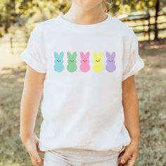 Colorful Easter Peeps t-shirts for your toddler or child! FEATURES * Rabbit Skins 4.5 oz., 100% combed ringspun cotton fine jersey t-shirt * Preshrunk, soft-washed, garment-dyed fabric * Design is printed on a white t-shirt * Printed with a direct to garment printer (DTG) - ink is printed into the fibers of the fabric for long-lasting wear that never fades! * Fast shipping (3-5 business days) * Beautifully packaged, and ready to gift for any special occasion! * All items are produced in Hartland Peeps Candy, Cute Marshmallows, Marshmallow Peeps, Easter Peeps, Easter Colors, Easter Shirt, Kids Easter, Easter Kids, Dyed Fabric