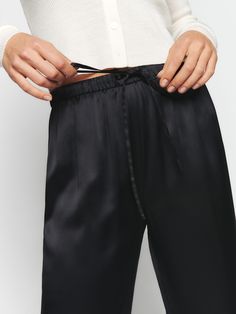 New silky. The Olina is fitted in the waist with a relaxed fitting leg and adjustable drawstring waist. Elegant Relaxed Fit Silk Pants, Sleek Non-stretch Black Pants, High-waisted Silk Pants With Elastic Waistband, Fitted Full-length Silk Pants, Silk Ankle-length Pants With Elastic Waistband, Silk Pant, Tie Waist Pants, Collar Cardigan, Silk Pants