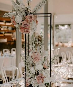 the centerpiece is decorated with pink and white flowers