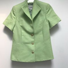 Valentino linen blazer perfect for spring.  Soft green with gold tone button front, winged collar, short sleeves and fully lined.  Made in Italy and tagged size 44.  Measures, 14" shoulder to shoulder, 8.5" sleeve, 36" bust, 30" waist, 38" hips and 22" shoulder to hem. For additional merchandise, please visit: https://www.ebay.com/str/eleganciatoo Classic Fitted Short Sleeve Outerwear, Classic Short Sleeve Single Breasted Outerwear, Classic Short Sleeve Outerwear For Formal Occasions, Classic Short Sleeve Outerwear For Formal Events, Classic Short Sleeve Fall Blazer, Formal Short Sleeve Outerwear For Fall, Wing Collar, Linen Crops, Linen Blazer