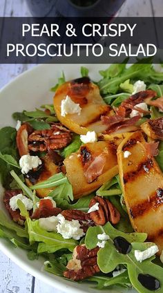 a white plate topped with salad and meat