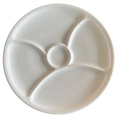 a white plate with an abstract design on it