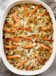 a casserole dish filled with shrimp and rice