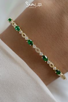 A pin of our emerald bangle that has emerald gemstones, diamonds, and gold. Elegant Green Oval Bangle, Elegant Oval Green Bangle, Elegant Green Stackable Bracelets, Elegant Green Cubic Zirconia Bracelets, Elegant Cubic Zirconia Bracelets For May Birthstone, Jewelry Gold Bracelet, Gold And Emerald, Jewelry Emerald, Bracelet Diamond