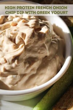 a white plate topped with a bowl of dip