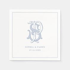 the monogramed initials on this wedding napkin are shown in light blue and white