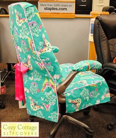 an office chair covered with a colorful cover in the shape of a reclining chair