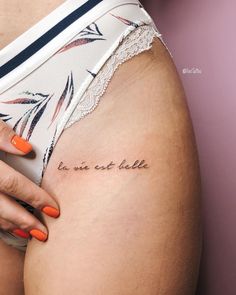 a woman with an orange manicure is holding her stomach and has the words be you at hello written on it