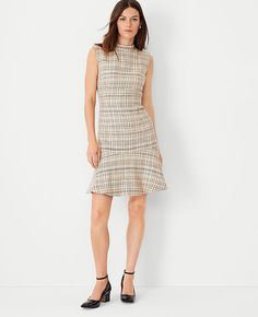 Elevate your wardrobe with the Ann Taylor Petite Tweed Mock Neck Flounce Dress, a piece that combines sophistication with comfort. This dress is ideal for women who appreciate a blend of classic style and modern flair.

- **Size:** Petite 2
- **Color:** Toasted Oat
- **Material:** Shell: 55% Cotton, 45% Acrylic; Lining: 100% Polyester
- **Gender:** Female
- **Features:** Sleeveless, mock neck, flounce hem, hidden back zipper with hook-and-eye closure
- **Length:** 20 inches from natural waist
- Flounce Dress, Knitted Suit, Mock Neck Dress, Sleeveless Dresses, Flounced Dress, Tweed Fabric, Petite Dresses, Above The Knee, Modern Woman