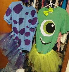 two t - shirts with monster faces on them and tutu skirts hanging in a closet