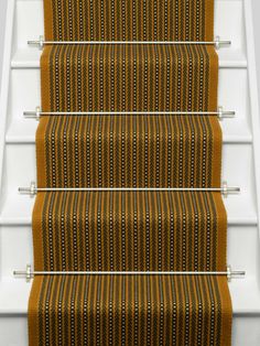 an orange and black striped stair runner