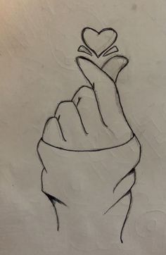 a drawing of a hand with a heart on it