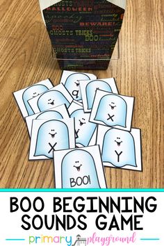 the boo beginning sounds game is shown in front of an open box on a wooden table