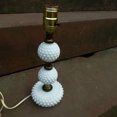 Vintage hobnail milk glass table or desk lamp . Lamp features 3 tiers of hobnail milk glass separated by metal columns. Made in the 1950s. Hobnail Milk Glass Lamp, Table Lamps Vintage, Metal Columns, Milk Glass Lamp, Glass Table Lamps, Vintage Table Lamp, Glass Table Lamp, The 1950s, Glass Table