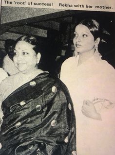 two women standing next to each other in black and white