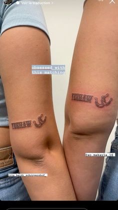 two people with matching tattoos on their arms