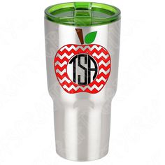 a stainless steel tumbler with an apple on it and the monogrammed initials