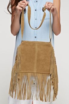 Fringed saddle bag with tear drop shaped stone. Self:100% leather/Lining:Polyester/Dimensions 32x27 Camel Satchel Shoulder Bag For Fall, Festival Bags For Fall, Bohemian Bags With Adjustable Strap For Fall, Fall Fringe Shoulder Bag, Rectangular Bags With Tassels For Fall, Fringe Shoulder Bag For Fall, Camel Bag With Adjustable Strap For Fall, Fall Camel Bag With Adjustable Strap, Fall Camel Bags With Adjustable Strap