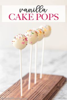 cake pops with sprinkles on a wooden tray