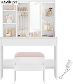 a white dressing table with drawers, mirror and stool in front of the vanity area