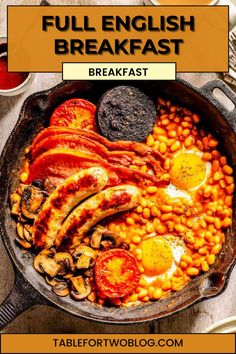 the full english breakfast with eggs, beans and sausage in a cast iron skillet