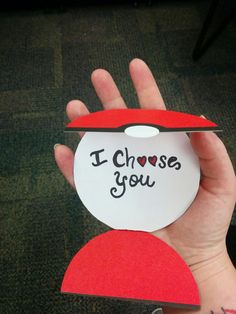 someone is holding up a piece of paper with the words i choose you on it