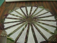 a close up of a quilted fan on a table