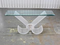 a glass table with an unusual design on it