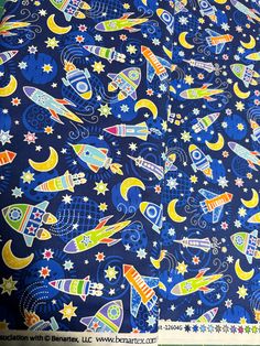 a blue background with colorful rockets and stars