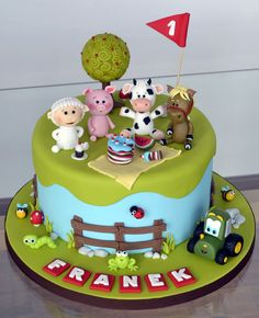 a cake with farm animals on the top