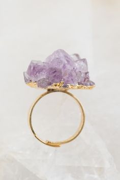 This stunning amethyst crystal ring, set in a delicate gold band, is a true showstopper! Perfect for brides or anyone looking for a bold, unique accessory. The raw amethyst adds a touch of natural beauty and elegance, making it a must-have piece for jewelry lovers. #CrystalRing #AmethystJewelry #StatementJewelry Halloween Styled Shoot, Beautiful Calligraphy, Raw Amethyst, Amethyst Jewelry, Crystal Ring, Halloween Fashion