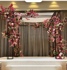 an image of a stage decorated with flowers