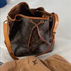 Louis Vuitton Vintage Bucket Bag W Dust Bag. Authentic. Shows Use And In Very Good Condition. Vintage Bucket Bag With Detachable Strap For Everyday Use, Louis Vuitton Vintage Bucket Bag Outfit, Luxury Vintage Bucket Bag With Leather Handles, Vintage Brown Bucket Bag With Adjustable Strap, Louis Vuitton Croisette, Louis Vuitton Tivoli, Louis Vuitton Neverfull Damier, Louis Vuitton Bucket Bag Vintage, Lv Pochette