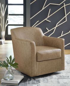 a brown chair sitting on top of a rug