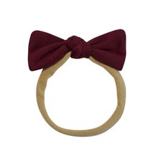 a wooden ring with a red bow on it's head and a white background