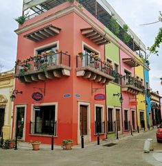 a colorful building with balconies and balconyes on the second floor is shown