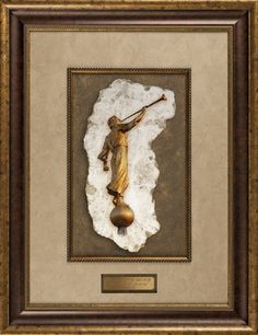 the crucifix is framed in a gold frame