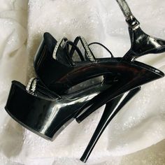 New, Never Worn In Black And Sliver. Heels Are 5 Inches Slick And Sexy. For That Special Date. No Damage, No Flaws, Original Price $125.00 From A Smoke Free Home. Make A Reasonable Offer. Glamorous Patent Leather Heels With 4-inch Heel, Sleek Silver Heels For Party, Silver Patent Leather Heels For Formal Occasions, Formal High Heel Shoes In Shiny Black, Sleek Silver Patent Leather Heels, Formal Silver Patent Leather Heels, Glamorous Shiny Heels With Pointed Toe, Formal Shiny Black High Heels, Sleek Silver Heels For Evening