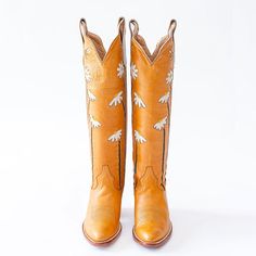 The Orange Lovely Chunky Heel Shoes are mid-calf western flower cowboy boots that combine style and comfort. Stand out with their vibrant color and chunky heel design. Color: Orange Heel Type: Chunky heel Heel height: 2.36" / 60 mm approx Product measurements were taken using size 8. Please note that measurements may vary by size. Toe: Pointed toe Floral pattern embroidery Handcrafted US sizing. Fits true to size. Bohemian Style Boots For Ranch In Spring, Bohemian Style Ranch Boots For Spring, Spring Ranch Mid-calf Snip Toe Boots, Spring Knee-high Heeled Boots For Ranch, Western Mid-calf Summer Boots, Western Style Yellow Boots For Spring, Summer Western Knee-high Boots, Western Knee-high Summer Boots, Western Style Knee-high Summer Boots