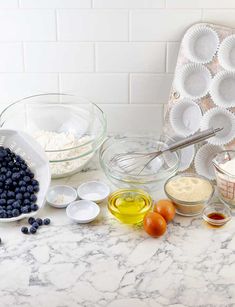 blueberries, eggs and other ingredients on a marble counter