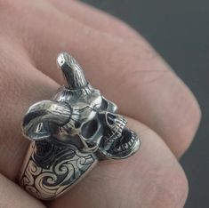 Satan lovers show yourself ! we all have our demons, such a fascination creature! Believe it or not, this skull ring will make your demon stronger and more evil! This devil face ring has a unique design, with beautiful details and a vintage touch; this masterpiece is fully painted in silver that makes it look old, and gives to this jewel a fantastic charm. As you may have noticed, the well-detailed screaming and angry skeleton head got astonishing characteristics; the nose, the teeth, the sharp Angry Skeleton, Devil Ring, Devil Face, Skeleton Head, Face Ring, Show Yourself, Skull Ring, A Novel, Fascinator