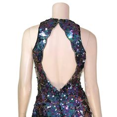 "This 80s-era trophy dress features a fun mermaid scale pattern of iridescent purple sequins and gold beads, a halter neck bodice with open back, and mini length skirt. Perfect for holidays, special occasions, or any time you need to glam it up a bit. Dress is unlined and zips up the back. Best fits size xs or small (please check measurements below). Accessories not included. Payment plans available. Approximate Flat Measurements: Multiply times 2 for bust, waist, and hip measurements. For best Stretch Mermaid Dress For Summer Night Out, Fitted Embellished Mermaid Evening Dress, Mermaid Dress With Sequins For Party Season, Sequin Mermaid Dress For Party Season, Sequin Mermaid Dress For Prom, Purple Sequin Dress For Prom Season, Purple Sequin Dress For Prom, Glamorous Mermaid Dress For Cocktail Party Season, Glamorous Mermaid Cocktail Dress For Party Season