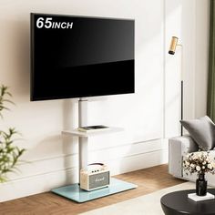 a flat screen tv sitting on top of a wooden stand