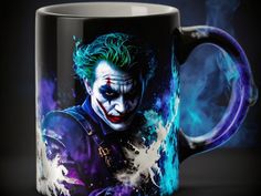 the joker movie character is painted on a black coffee mug with blue and purple paint