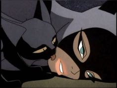 batman and catwoman face to face in the animated version of batman's mask