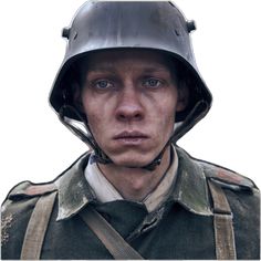 a man with a helmet on his head is looking at the camera while wearing an army uniform