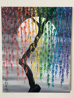 a painting of a tree with colorful flowers hanging from it's branches in front of a full moon