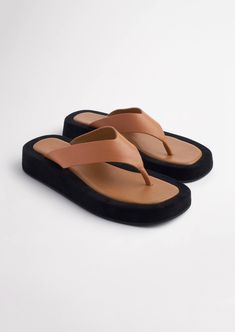 Embodying a truly 90's vibe, the Ives thong sandals will soon be on high rotation all summer long. Designed to take comfort to a whole new level, these slip-ons feature a thong-style toe-strap, a chunky cushioned platform sole, a genuine leather upper and all new leather lining. -Material: ALL NEW Leather Upper & Lining -Sole: Man-Made -Fit: True to size -Toe-shape: Rounded -Features: Chunky platform sole -Heel: 3.5cm Kids Heels, Shop Heels, Women Slippers Fashion, Cute Shoes Heels, Fashion Shoes Sandals, Shoes Outfit Fashion, Heels Online, Fashion Slippers, Tony Bianco