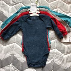 4-Pack Boys Long Sleeve Bodysuit. Brand New Fall Playtime Fitted Bodysuit, Fitted Bodysuit For Playtime In Fall, Fitted Winter Onesie For Playwear, Winter Fitted Onesie For Playwear, Long Sleeve Bodysuit For Playwear, Solid Color Long Sleeve Bodysuit For Playwear, Boys Long Sleeve, Long Sleeve Bodysuit, Blue Black