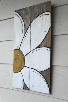 an image of a white flower painted on wood